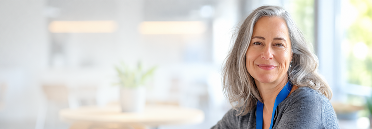 Smiling woman with long silver hair – herbs for heart health and circulation.